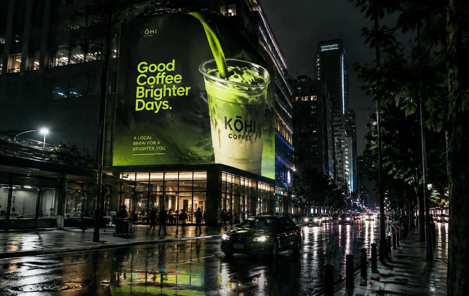 Digital billboard on a city street at night